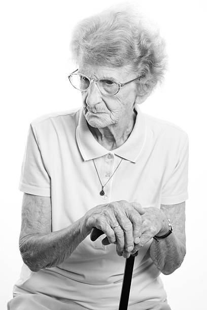 istock senior woman with her walking stick 106590305