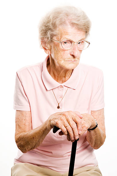 istock senior woman with her walking stick 106590306