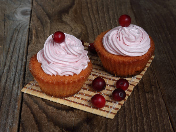 istock Cupcakes decorated with cranberries and marshmallows, homemade baking. 1065907594