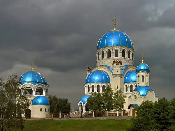 MOSCOW, RUSSIA - Beautiful Cathedral of the Holy Vivifying Trinity at Borisovo Ponds with shining enameled blue domes against the gray skies. The church was built at in Byzantine style in 2001-2004.