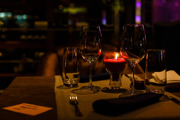 istock Two wine glasses and defocused lights at the restaurant 1065932202