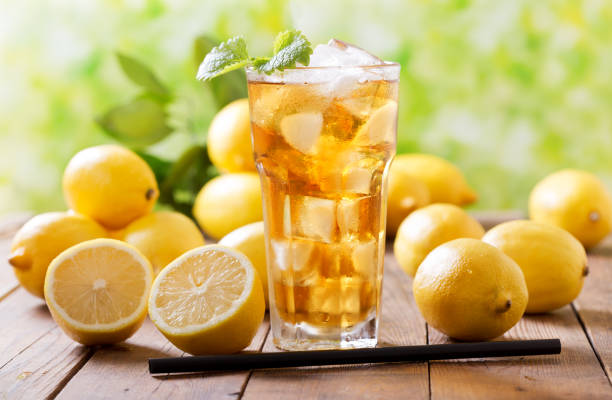 istock lemon iced tea in a glass with fresh fruits 1065932482