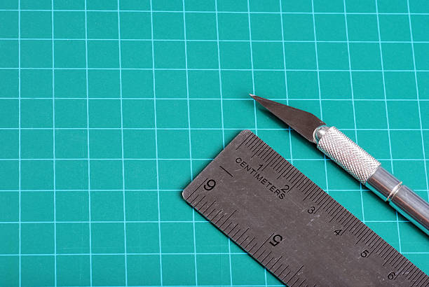 istock ruler knife on a green cutting mat 106593955