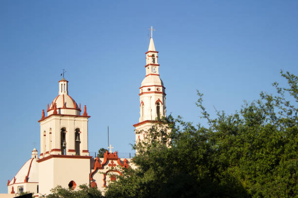 istock Colonial church standing in the background behind some trees 1065943474