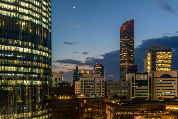 Sandton cityscape during the blood moon eclipse with its skyscrapers and downtown corporate offices. Sandton has become home to most of the major financial, consulting and banking firms in South Africa.