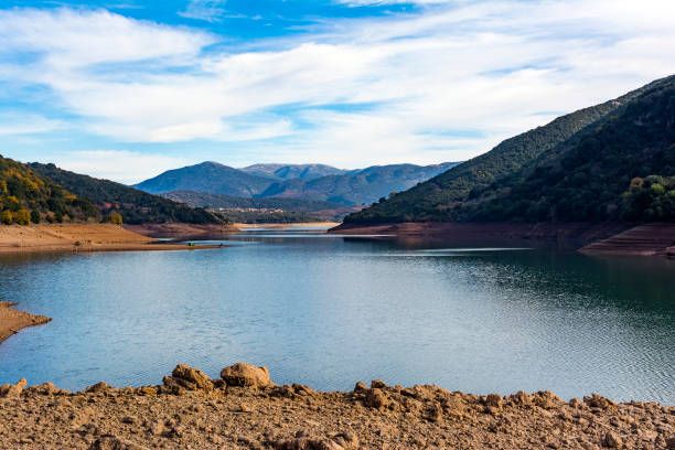 istock Ladonas artificial lake in Greece against a blue sky with clouds, and mountains as background 1065952676