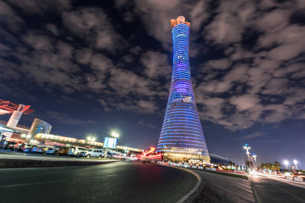 torch hotel in night doha qatar - editorial tall luxury contemporary imagens e fotografias de stock