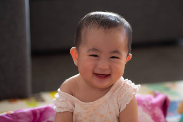 istock Cute 6 month old baby with strawberries 1065964392