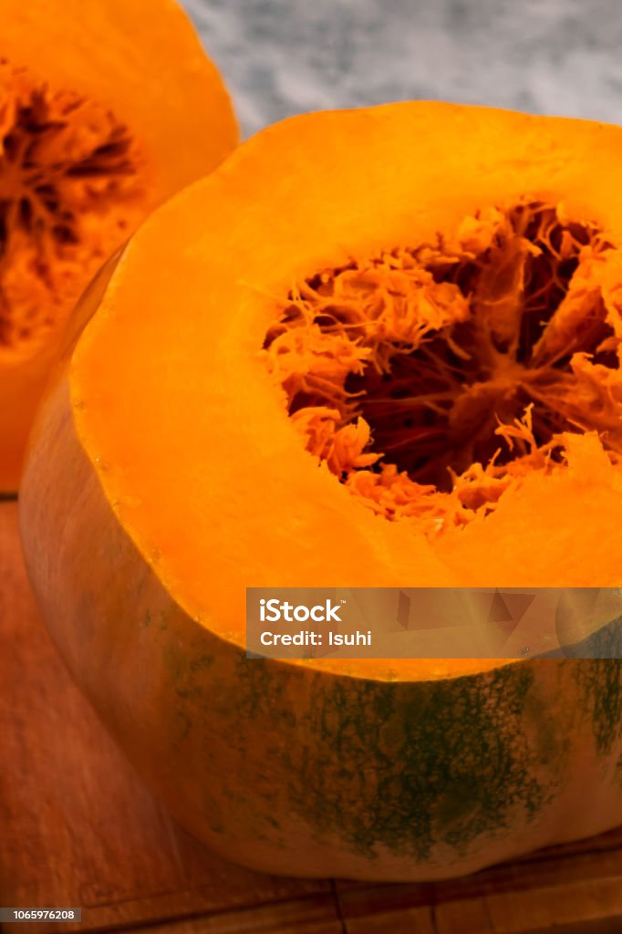 Sliced ripe pumpkin with orange flesh. Backgrounds Stock Photo