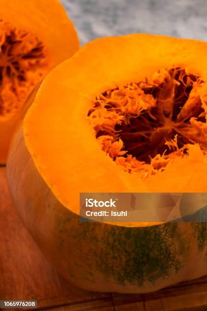 Sliced Ripe Pumpkin With Orange Flesh Stock Photo - Download Image Now - Backgrounds, Boarding, Bright
