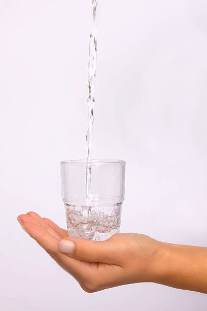 istock Hand with glass of water 106597841