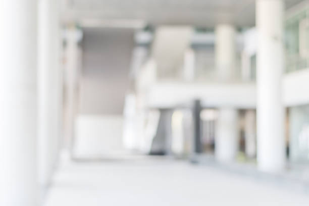 istock Business blur background office lobby hall interior white room with blurry light from corridor glass wall 1065978588