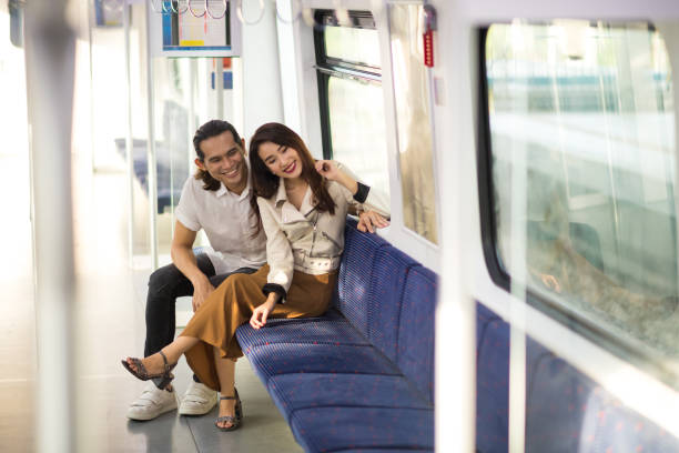 istock Couple commuting on public transportation 1065979044