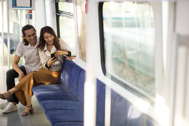 istock Couple commuting on public transportation 1065979322