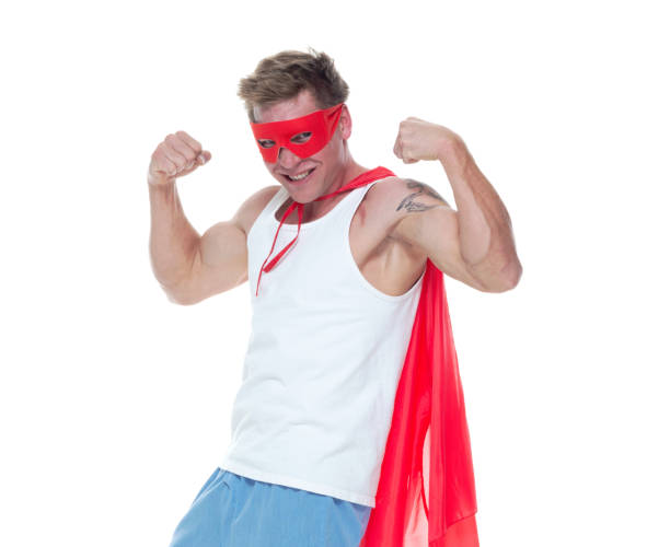istock Man wearing pajamas and super hero cape 1065979526