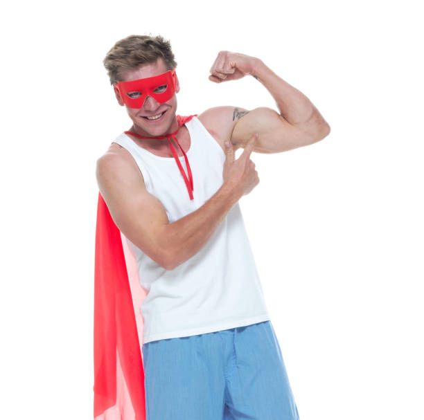 istock Man wearing pajamas and super hero cape 1065979542