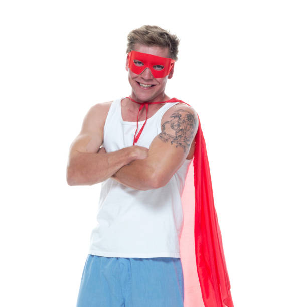 istock Man wearing pajamas and super hero cape 1065980642