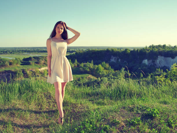 istock Woman posing on a sunny day outdoors on nature 1065983720