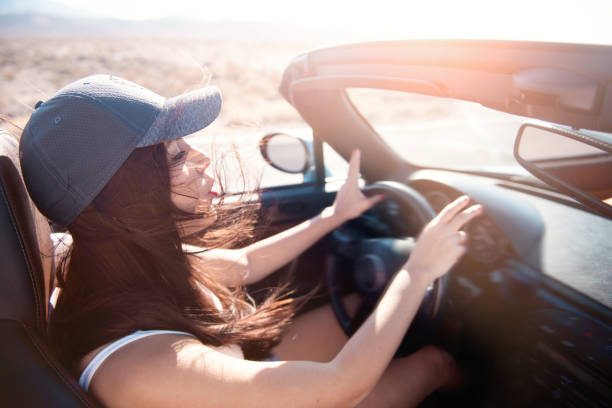 istock Woman driving car during Road Trip 1065985544
