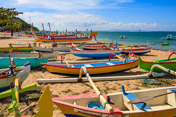Traditional Balinese fishing boats Traditional Balinese fishing boats, Sanur beach, Bali, Indonesia outrigger stock pictures, royalty-free photos & images