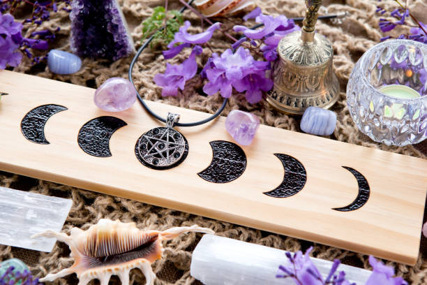 istock Witch Pagan Moon Phases Altar with crystals and flowers 1066016378