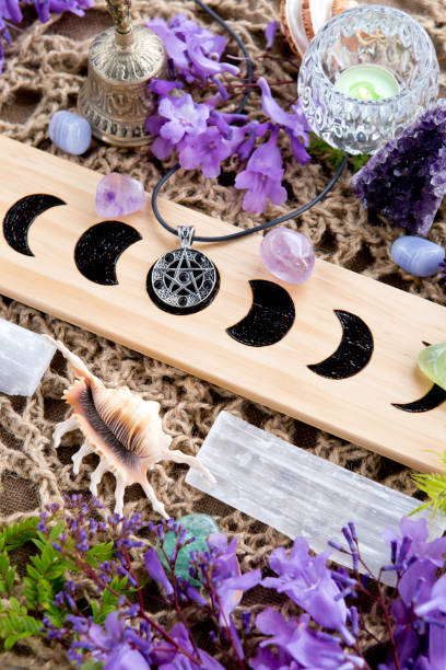 istock Cleansing Ceremony Witch Pagan Moon Phases Altar with crystal, flowers and pentacle 1066016430