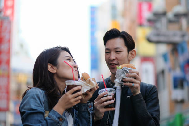 istock Couple drinking coffee on street 1066044148
