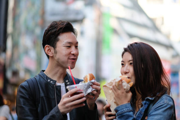 istock Couple drinking coffee on street 1066044152