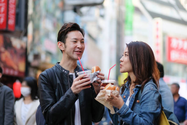 istock Couple drinking coffee on street 1066044208