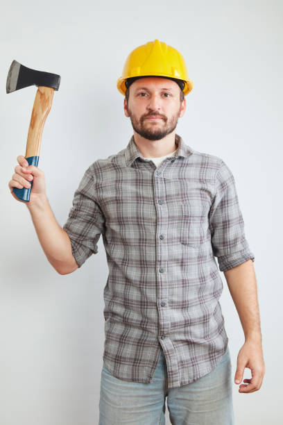 istock Smiling lumberman standing with an axe 1066051600