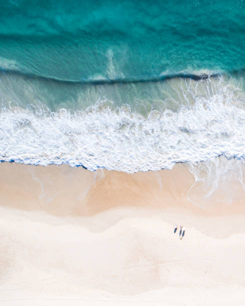 aerial view of a beach and water. - high angle view beach sea coastline imagens e fotografias de stock