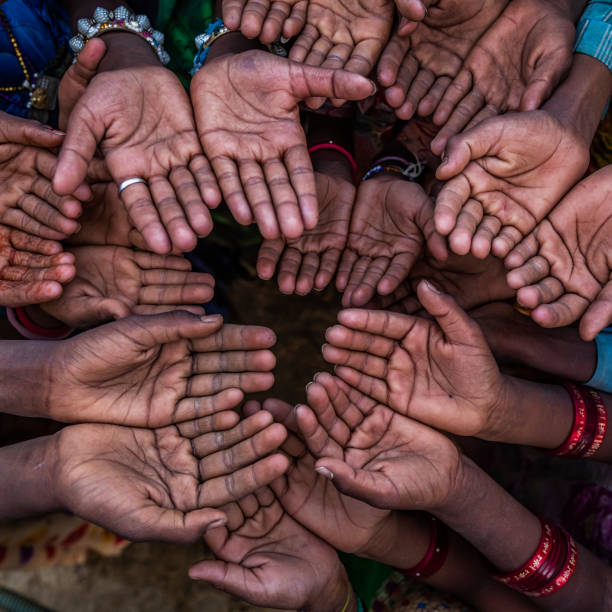 istock Hunger in Africa - hands asking for food 1066069976