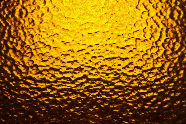 istock glass corrugated background with gradient in yellow and orange tones. 1066075026