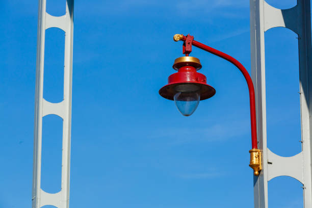Lamp post on a bridge, on a background of blue sky