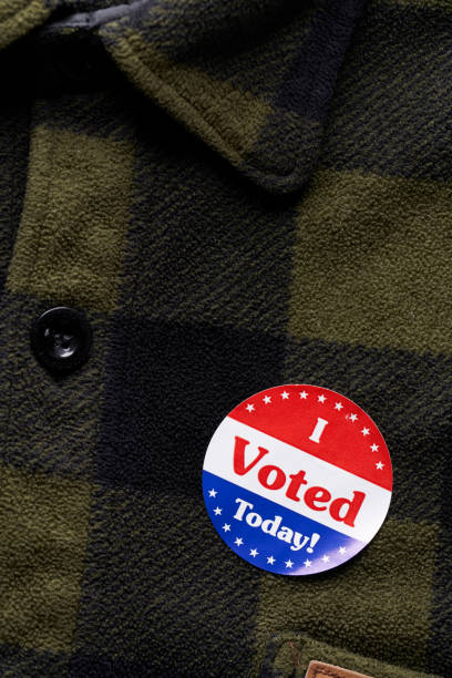 istock I VOTED sticker on man's flannel shirt 1066084332