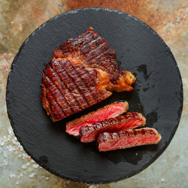 istock beef steak Grilled with spices (piece of meat). Top view with copy space 1066086358