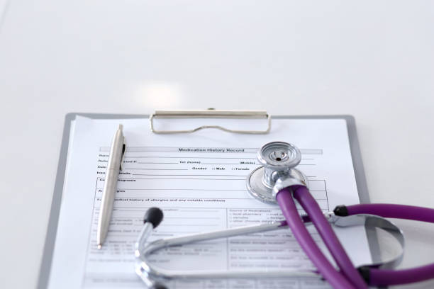 istock Medication history record form lying on table with stethoscope and silver pen. Medicine or pharmacy concept. Medical tools at doctor working table 1066088334
