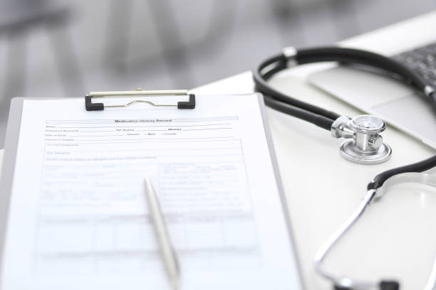 istock Stethoscope, clipboard with medical form lying on hospital reception desk with laptop computer. Medical tools at doctor working table.Medicine aÑÐ² health care concept 1066088342