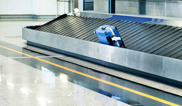 istock Suitcase on conveyor belt in the airport 1066091996