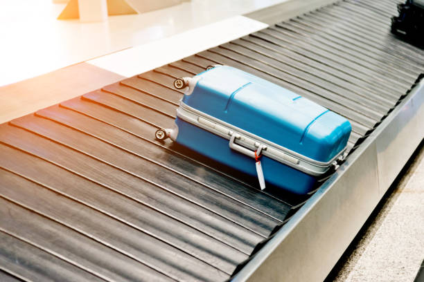 istock Suitcase on conveyor belt in the airport 1066092008