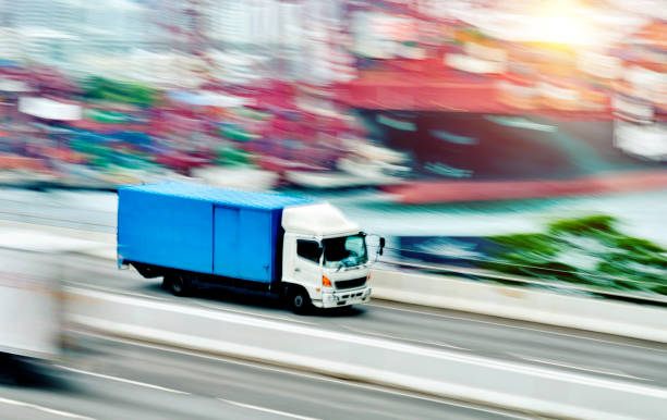istock Blue truck leaving the harbor 1066103398
