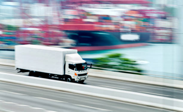 istock White truck leaving the harbor 1066103456