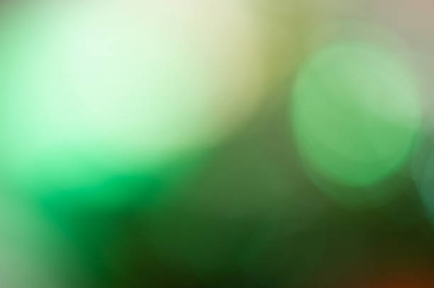 istock holiday lighting effects of different colors and spots on a light background. Blurred background. 1066109906