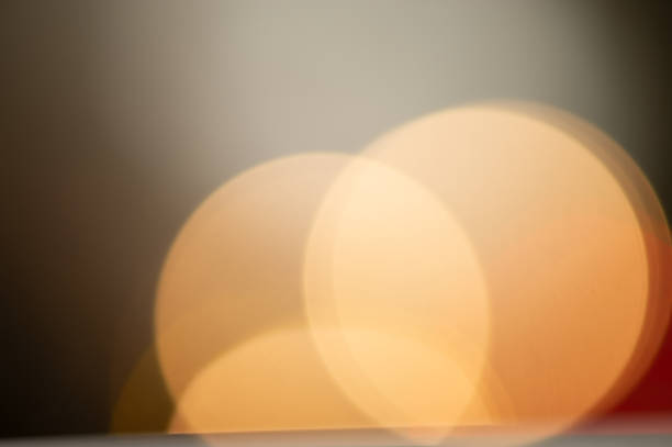 istock festive light illumination and light spots on a dark pastel background. 1066110002