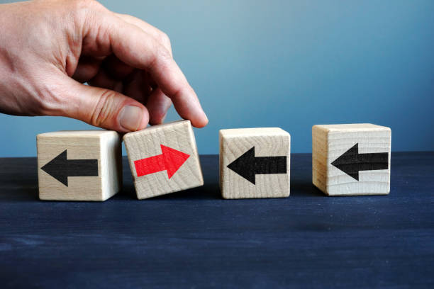 istock Innovation in the business. Cubes with arrows and one with another direction. Uniqueness, difference and individuality. 1066115520