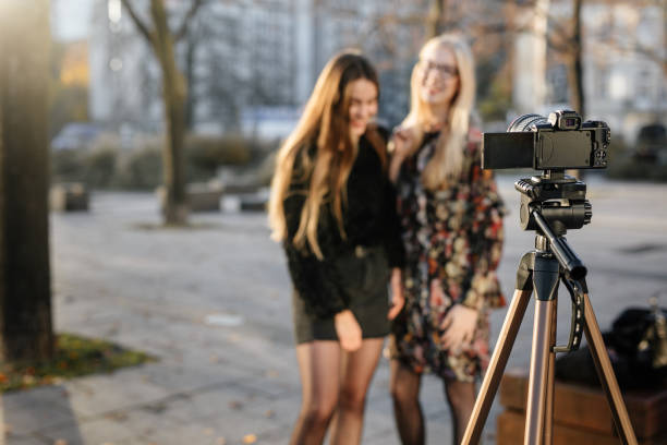 istock Two vlogers film video for personal website 1066117182
