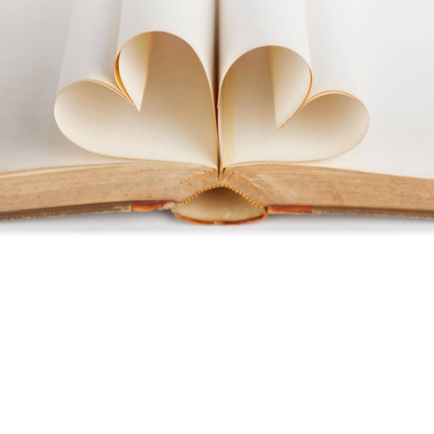 istock Pages of open book rolled in heart shape 1066119824