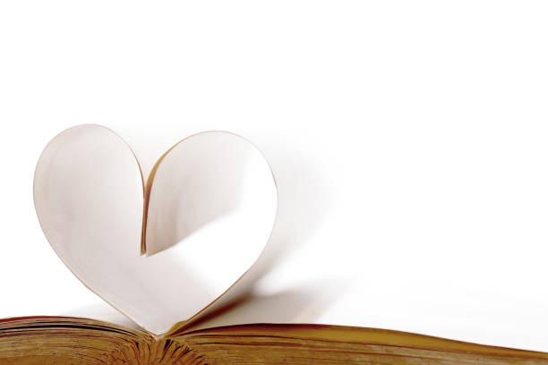 istock Pages of open book rolled in heart shape 1066119866
