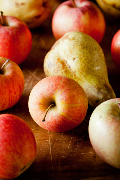 istock Bunch Of Apples And Pears On A Wooden Table 1066121290