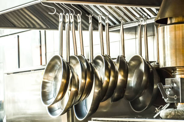 istock Metal pans hang in the kitchen. Decorative kitchen for cooking courses 1066122600